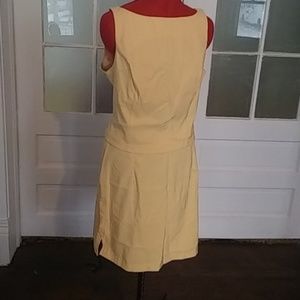 2 piece business set. Pale yellow. Top side zip. B